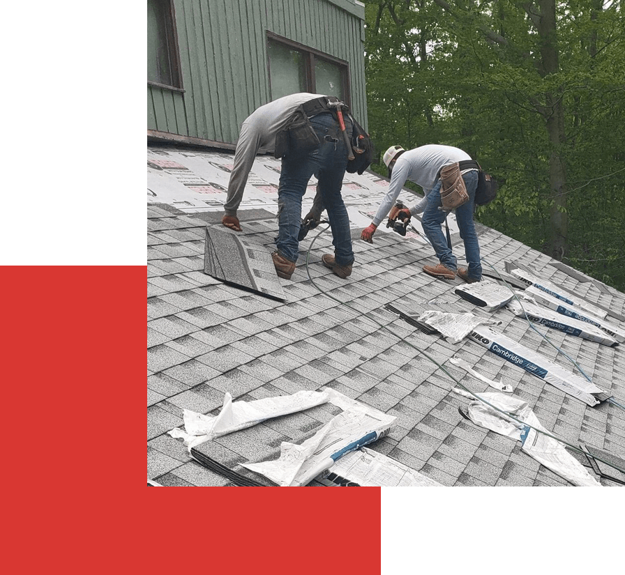 A group of men working on the roof of a building.